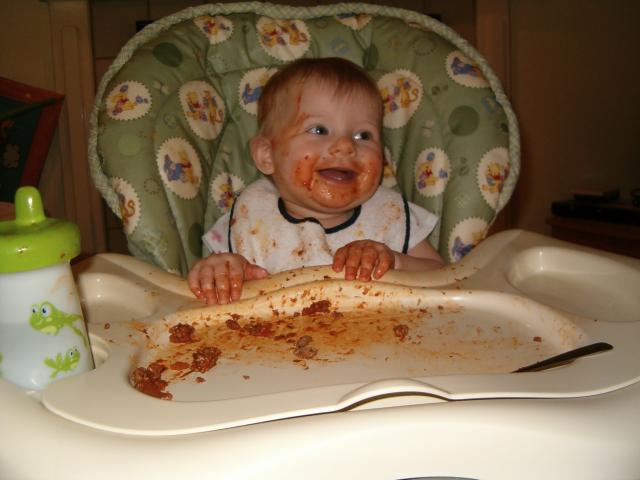 Callie loves eating, rather smearing, spaghetti.
