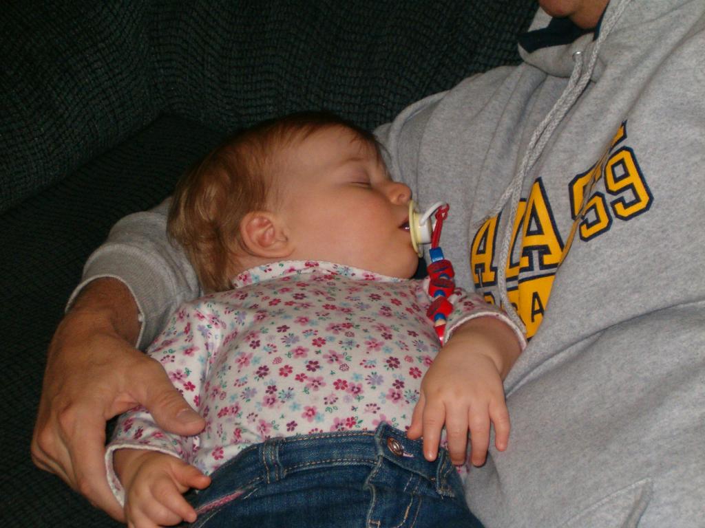 Callie naps in Grandpa's arms