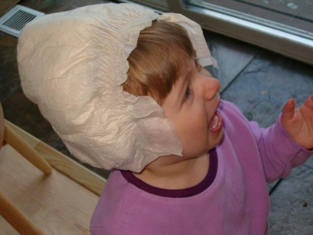 Callie bugged Mommy to put her diaper hat on, then got mad when she did.